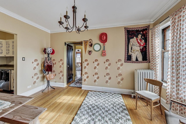 interior space with radiator heating unit, ornamental molding, wood-type flooring, and plenty of natural light