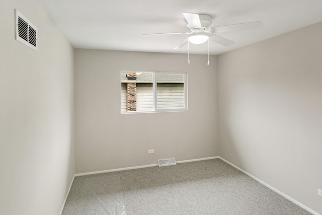 carpeted spare room featuring ceiling fan