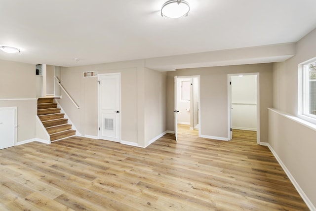 unfurnished room with light hardwood / wood-style floors