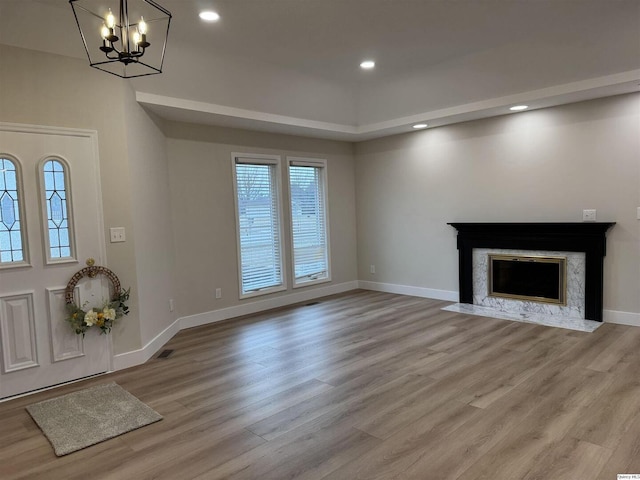 1501 Gayla Dr, Quincy, IL 62305 - foyer featuring a chandelier, wood finished floors, a fireplace, and recessed lighting