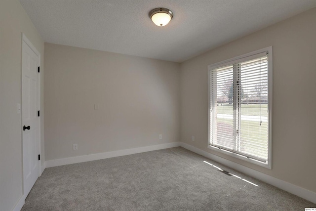 1501 Gayla Dr, Quincy, IL 62305 - spare room featuring carpet and a textured ceiling