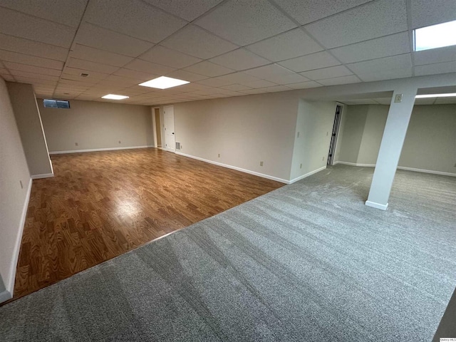 1501 Gayla Dr, Quincy, IL 62305 - finished basement featuring carpet flooring, a paneled ceiling, and wood finished floors
