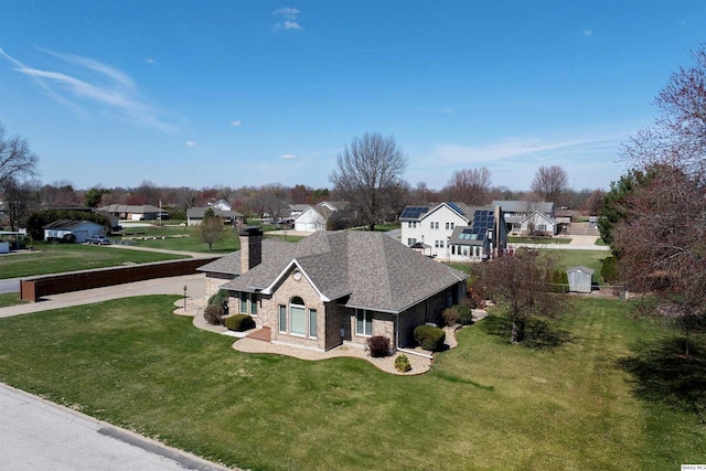 drone / aerial view with a residential view