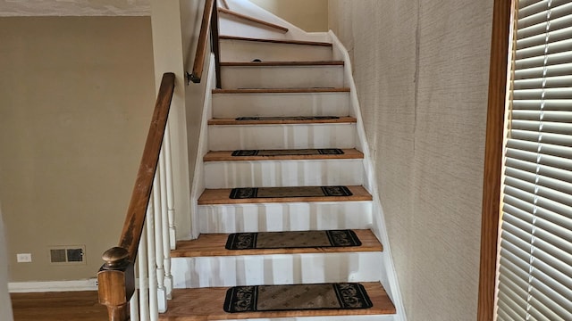 staircase with visible vents