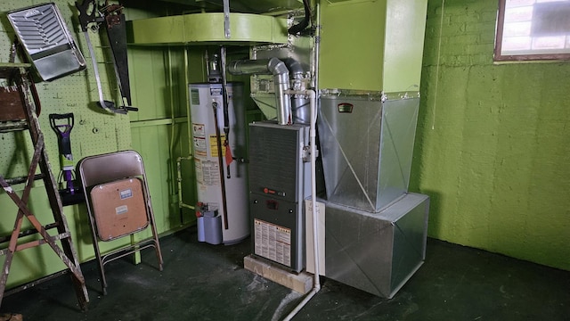 utility room featuring water heater and heating unit