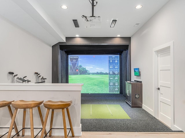 interior space with baseboards, carpet flooring, golf simulator, and recessed lighting