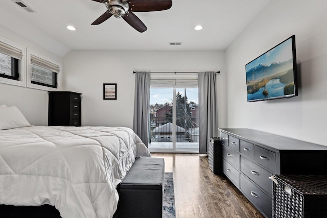 bedroom featuring lofted ceiling, dark wood-type flooring, access to outside, and ceiling fan