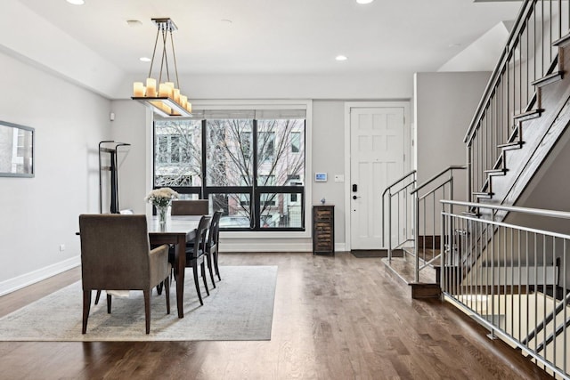 dining room featuring beverage cooler, dark hardwood / wood-style flooring, and a chandelier