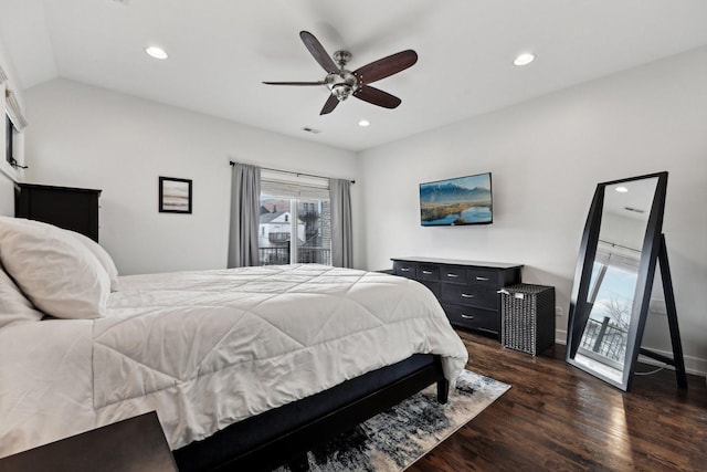 bedroom with lofted ceiling, dark wood-type flooring, and ceiling fan