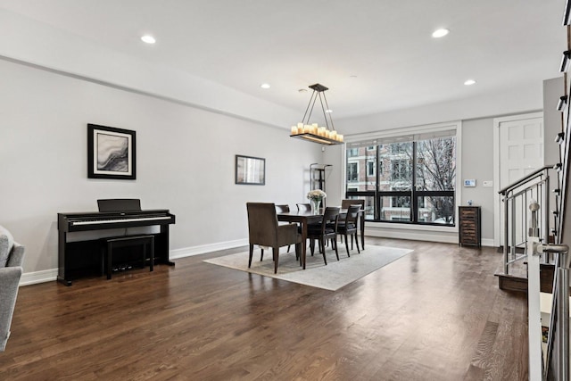 dining space featuring beverage cooler, dark hardwood / wood-style floors, and a notable chandelier