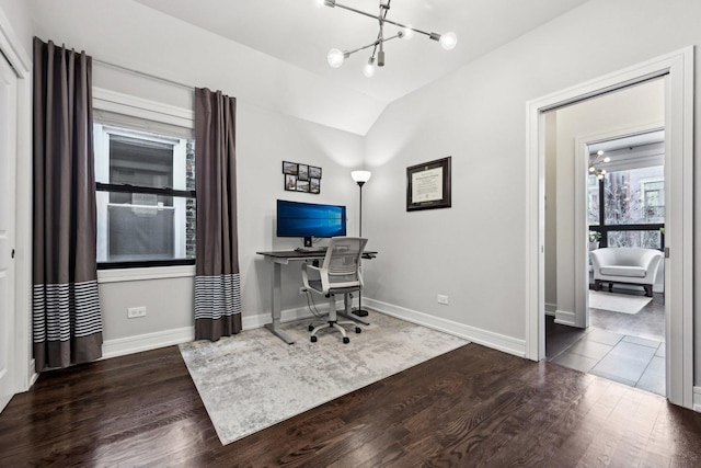 office with a notable chandelier, vaulted ceiling, and dark hardwood / wood-style floors