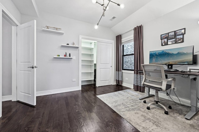 home office with rail lighting, vaulted ceiling, and dark hardwood / wood-style floors