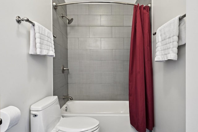 bathroom with toilet and shower / tub combo