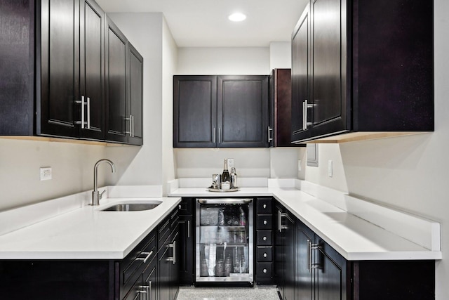 kitchen featuring wine cooler and sink