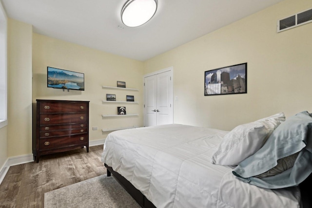 bedroom featuring hardwood / wood-style flooring