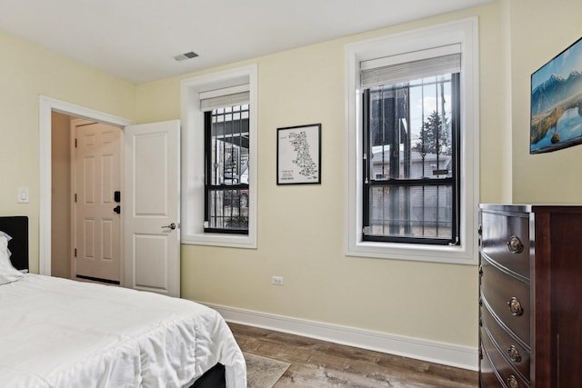 bedroom with hardwood / wood-style flooring