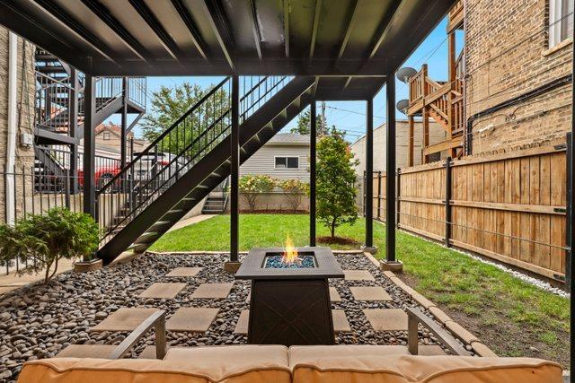 view of patio / terrace with an outdoor fire pit