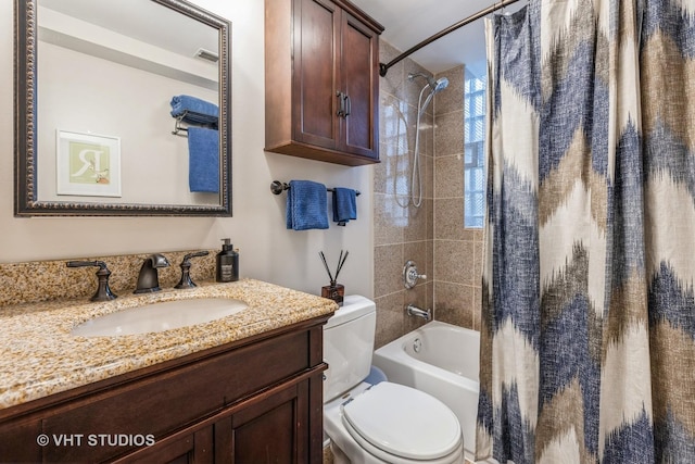 full bathroom featuring visible vents, vanity, toilet, and shower / bathtub combination with curtain