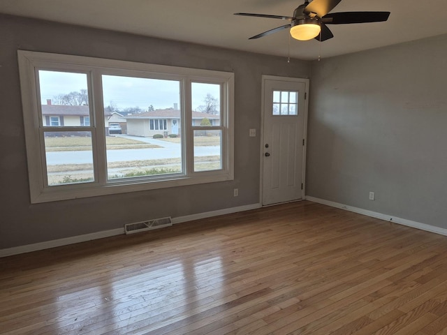 entrance foyer with ceiling fan and light hardwood / wood-style floors