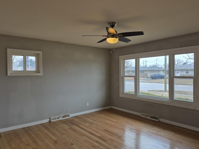 spare room with ceiling fan and light hardwood / wood-style flooring