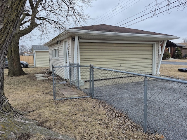 view of home's exterior with an outbuilding and a garage