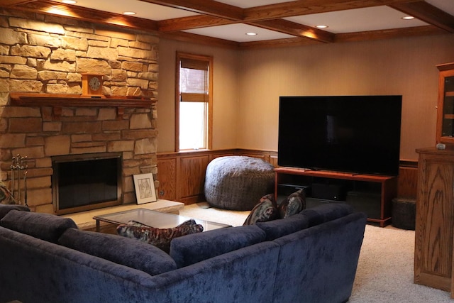 carpeted living room featuring beamed ceiling, coffered ceiling, and a stone fireplace