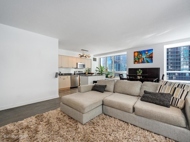 living room with baseboards and wood finished floors