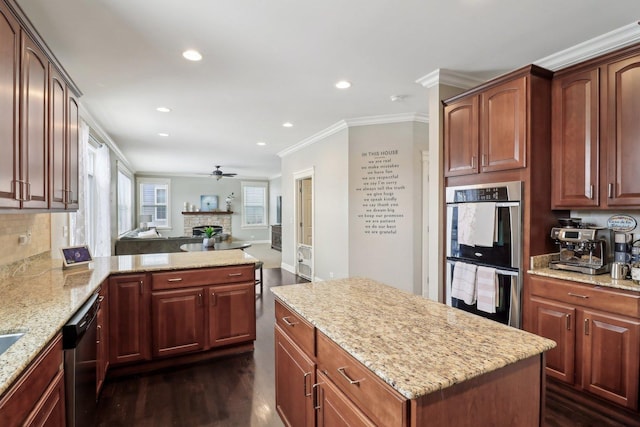 kitchen featuring stainless steel double oven, dishwasher, light stone counters, and dark wood-type flooring