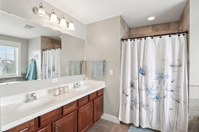 bathroom featuring tile patterned floors, vanity, and a shower with curtain