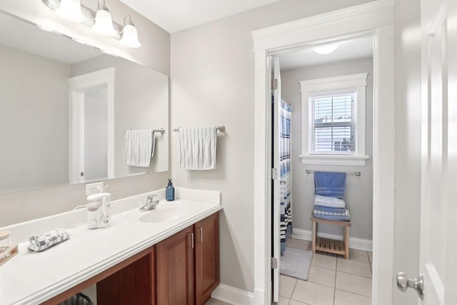 bathroom with tile patterned flooring and vanity