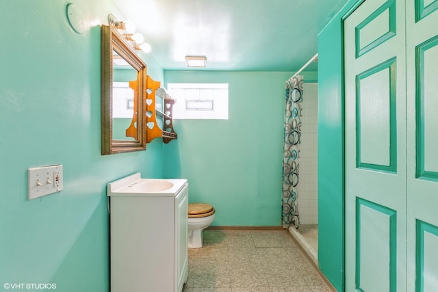 bathroom with vanity, a shower with curtain, and toilet