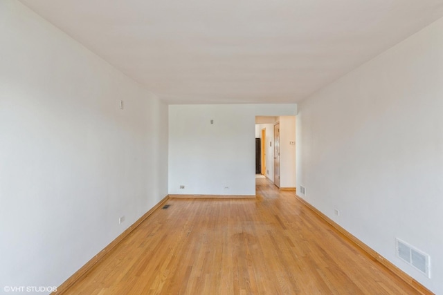 spare room featuring light hardwood / wood-style flooring