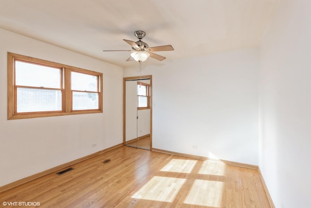 spare room with ceiling fan and light hardwood / wood-style floors