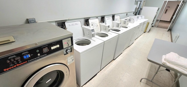 common laundry area featuring washer and clothes dryer