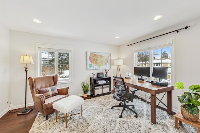 office with a healthy amount of sunlight, baseboards, and wood finished floors