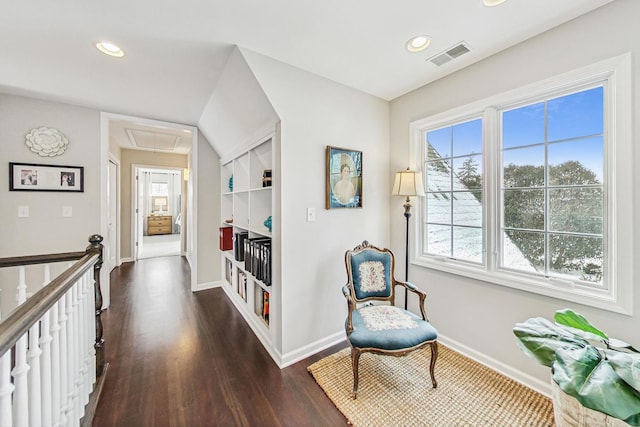 living area featuring recessed lighting, dark wood-style flooring, visible vents, baseboards, and attic access