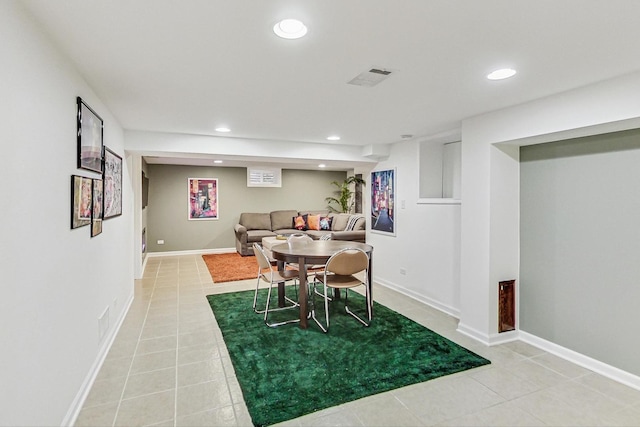 tiled dining space featuring baseboards, visible vents, and recessed lighting