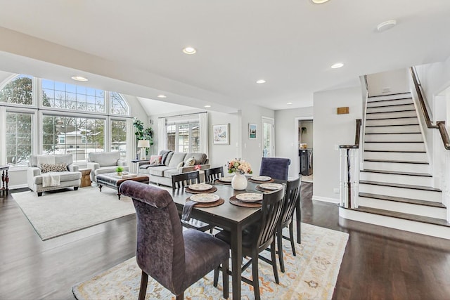 dining area featuring baseboards, dark wood finished floors, lofted ceiling, stairway, and recessed lighting