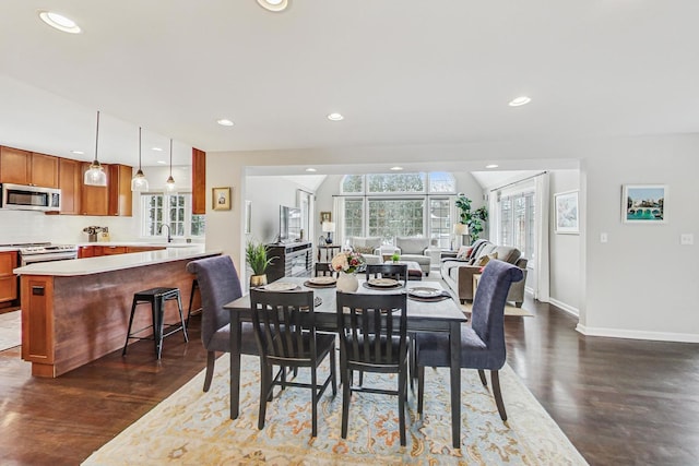 dining area featuring baseboards, dark wood-style flooring, and recessed lighting