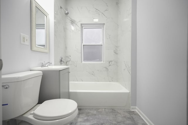 full bathroom with vanity, tiled shower / bath combo, and toilet