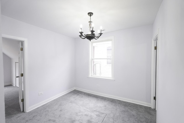 unfurnished room with carpet flooring and an inviting chandelier