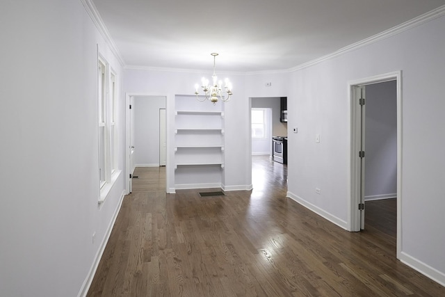 unfurnished dining area featuring ornamental molding, dark hardwood / wood-style floors, and a chandelier