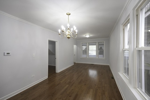 unfurnished dining area with crown molding, a chandelier, and dark wood-type flooring