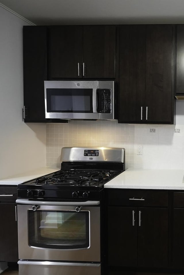 kitchen featuring decorative backsplash and stainless steel appliances