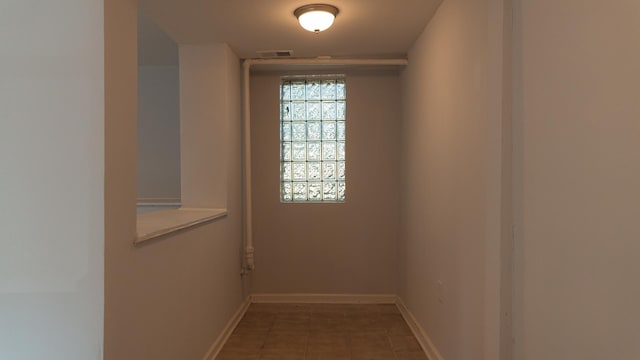 empty room with tile patterned flooring