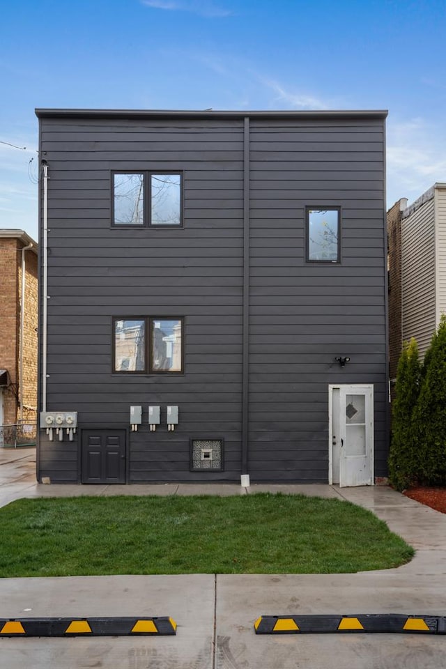 view of home's exterior featuring a lawn