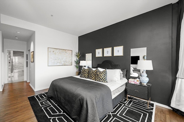 bedroom with wood-type flooring