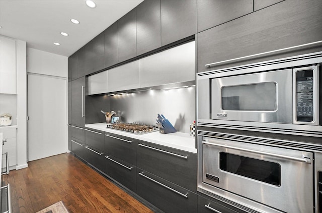 kitchen with dark wood-type flooring and appliances with stainless steel finishes