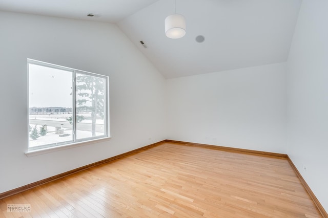 bonus room featuring vaulted ceiling and light hardwood / wood-style flooring