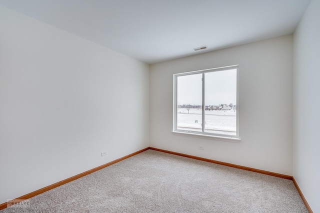 empty room featuring carpet flooring